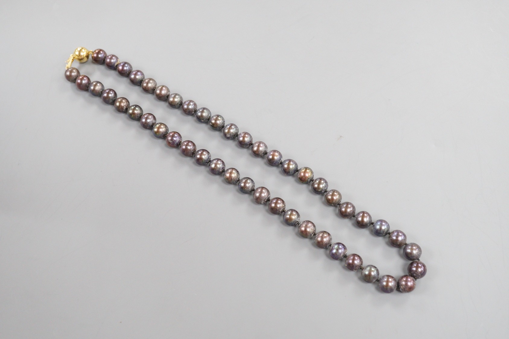 A modern single strand freshwater Tahitian style pearl necklace, with 375 yellow metal clasp, 44cm.